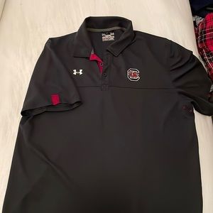 A black under armor dri fit South Carolina Gamecocks polo.